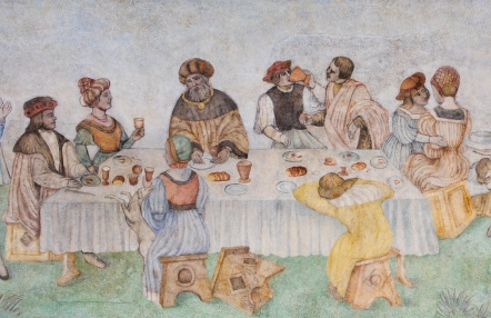 fragment zabytkowego malowidła, scena uczty, zastawiony stół i postacie uczestników w strojach renesansowych